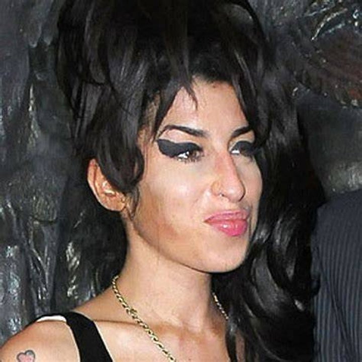 Amy Winehouse's exhusband says he 'cashed in' on her life after she