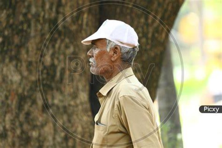an old man wearing a suit and tie