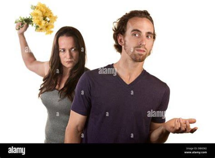 Angry Woman with Flowers and Naive Man &mdash; Stock Photo &copy; creatista 16039551