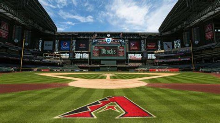 Arizona Diamondbacks' Craig Counsell, left, holds his sons, Brady