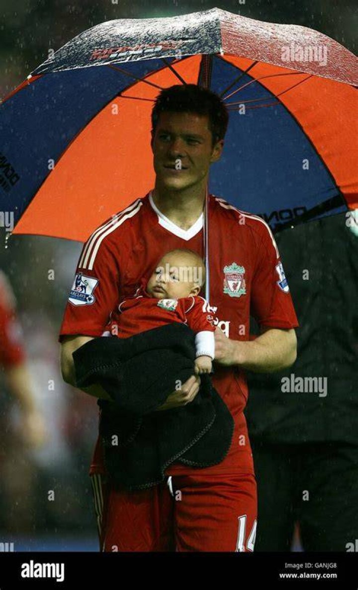 Liverpools xabi alonso his daughter during the lap of honour hires