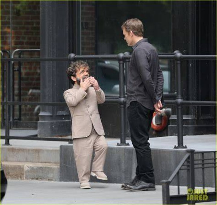 Peter Dinklage enjoys a whistle as he pushes his rarely seen daughter