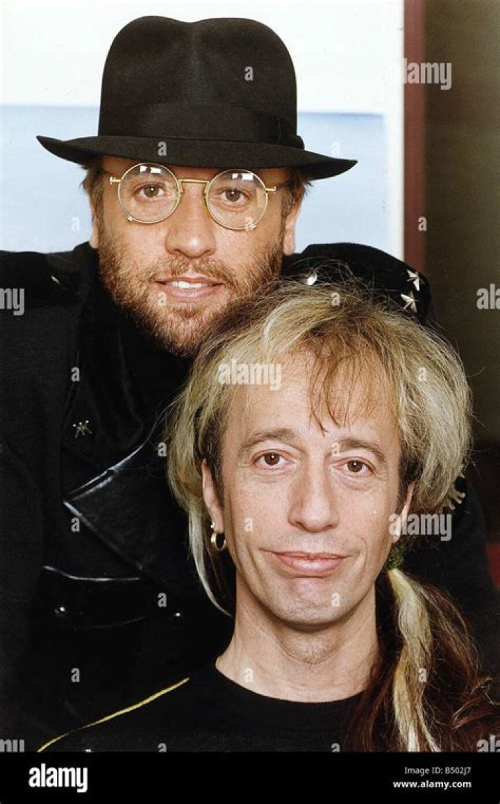 Robin Gibb. He is Maurice's twin. One of the Bee Gees. Singer, Robin