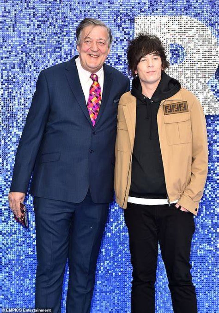 Stephen Fry and his husband Elliott Spencer attend Princess Eugenie's