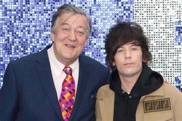 Stephen Fry and husband seen in rare public appearance at the royal