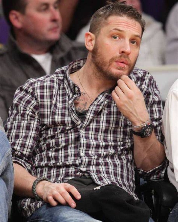 Tom Hardy cuts a casual figure as he goes shopping with his eldest son