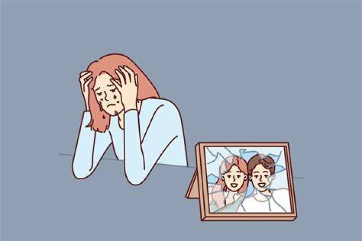 Woman cries after breaking up with husband and is sad sitting near